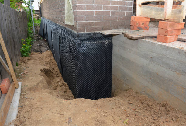 SJ Waterproofing Pros technician performing targeted Wet Basement Repair assessment in Russiaville, IN